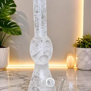 Frosted Rocketship Bong 16.5" 2 x Percolators A clear Detailed photo showcasing the glass piece, there is marble tiled floor with plants in the background.