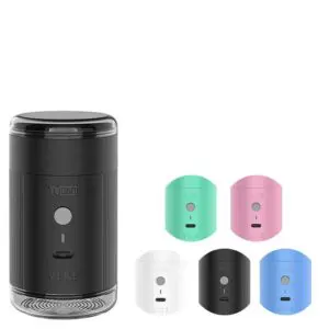 Black plastic tube and five little tubs with white background